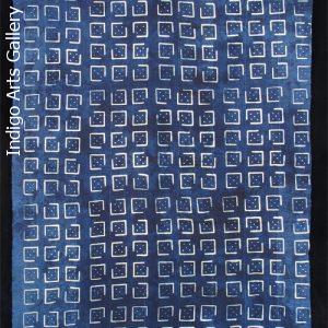 Indigo resist-dyed strip-weave cloth