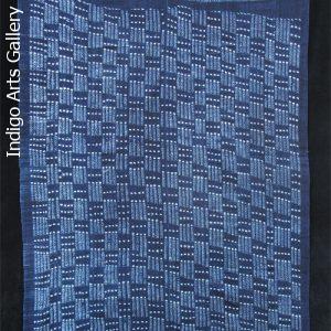 Indigo stitch-resist dyed strip-weave cloth