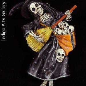 Calavera Bruja with a basket of skulls - retablo figure